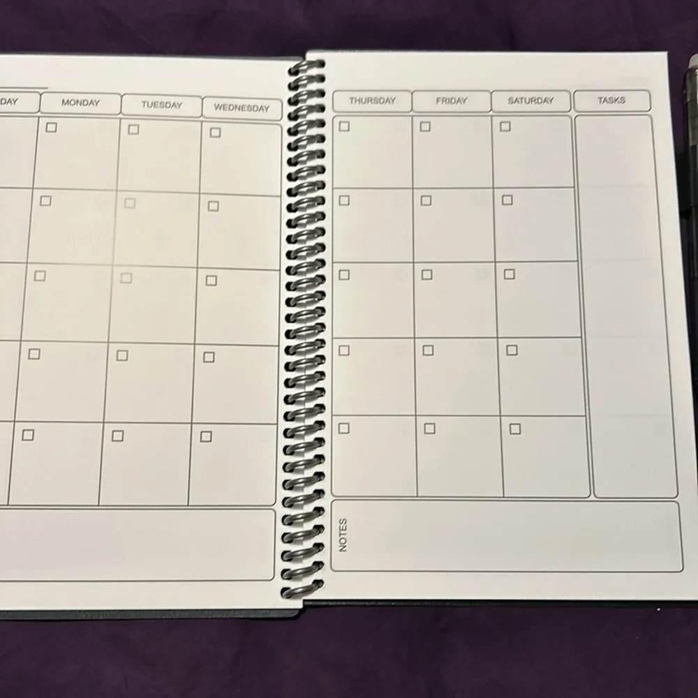 Smart book planner includes pen and cleaning cloth